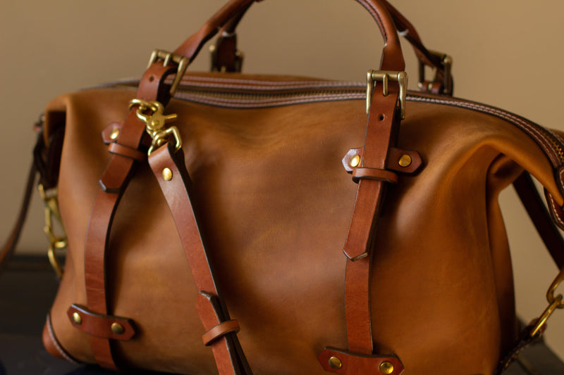 side view leather duffel close up 