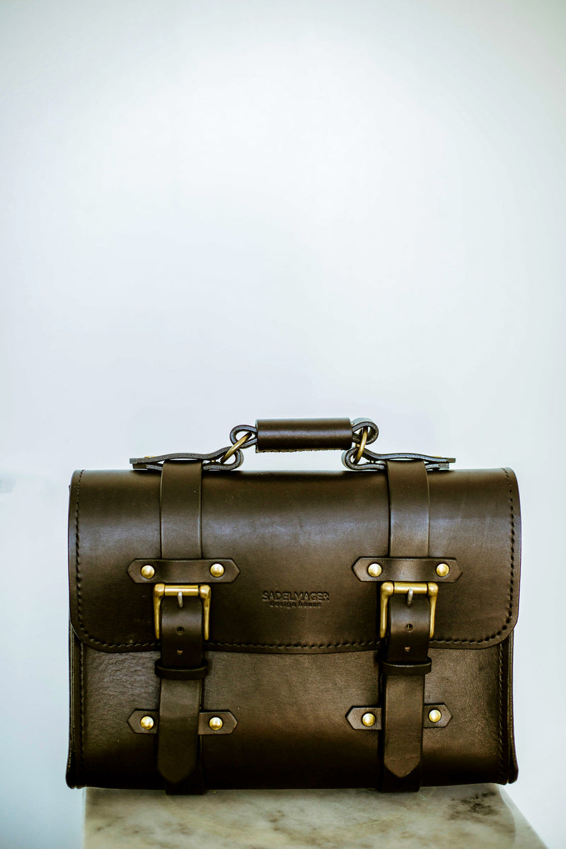 oldenburg medium leather messenger bag in black with brass buckles  