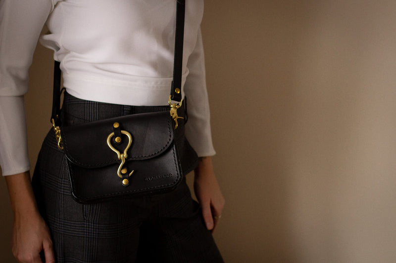 canadian leather bag in black with brass