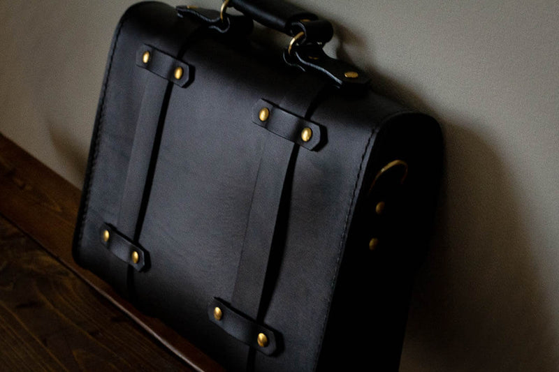 back of black leather satchel