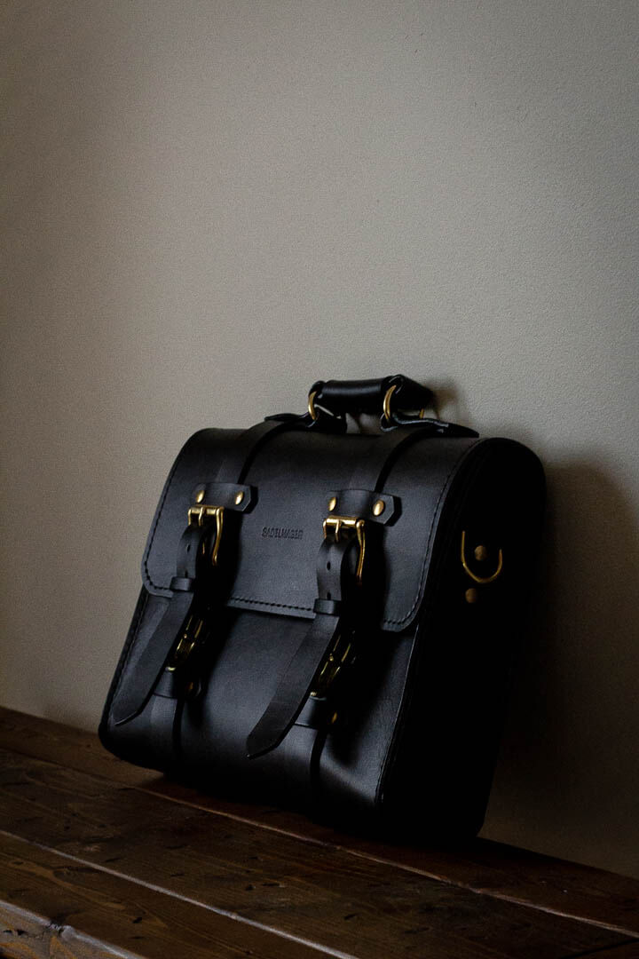 front of black leather satchel made in canada