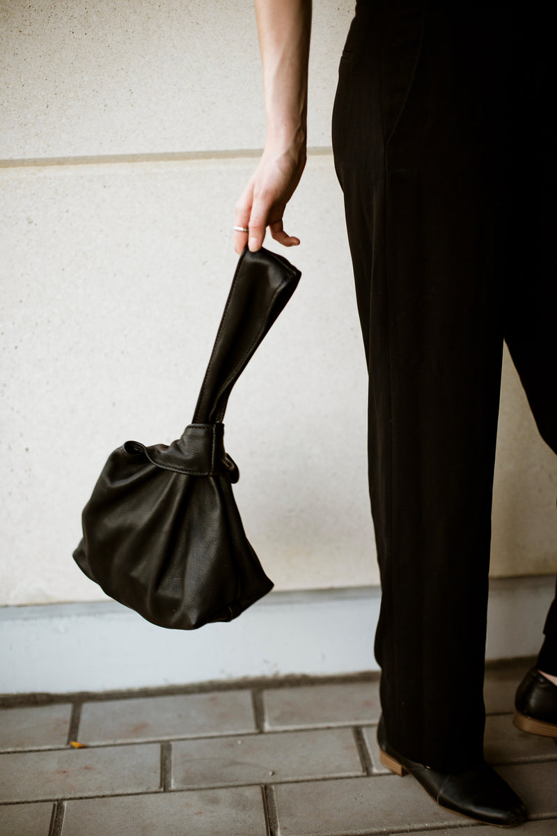 modelled black leather bag in canada