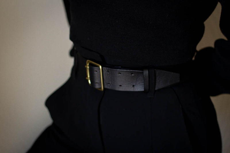 modelled black leather belt made in Canada