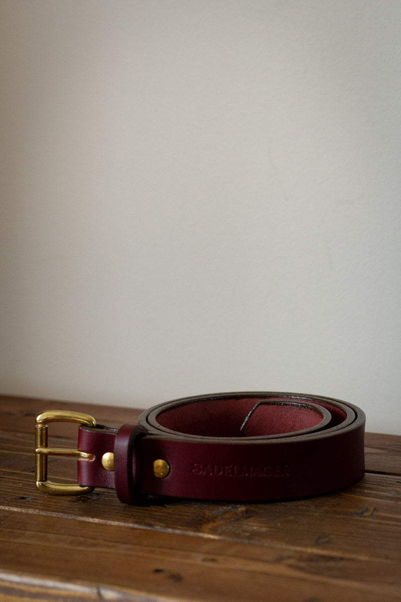leather red and brass belt
