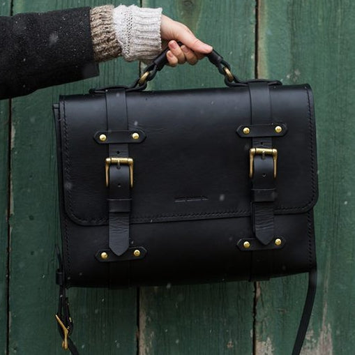 Oldenburg large leather messenger bag in black with brass buckles