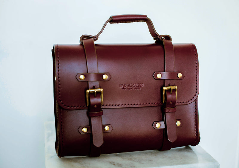 oldenburg small leather messenger bag in oxblood with brass buckles  