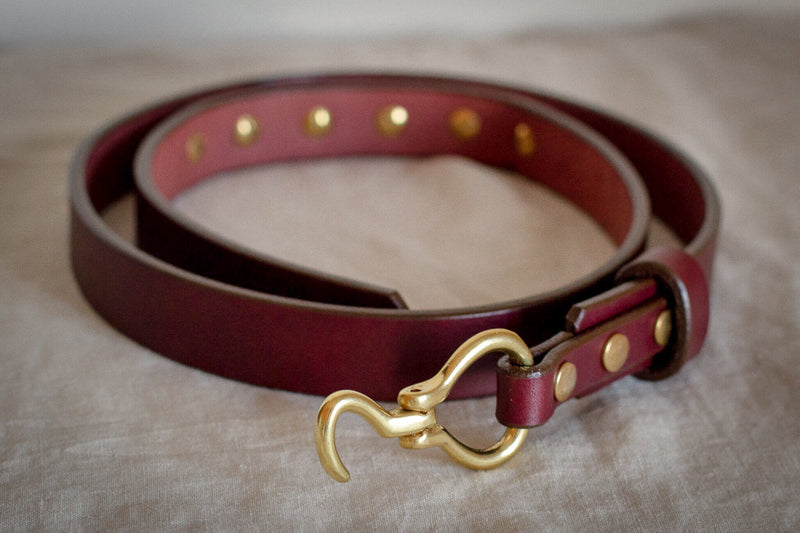 small hook style belt hoofpick with red oxblood leather and solid brass made in canada
