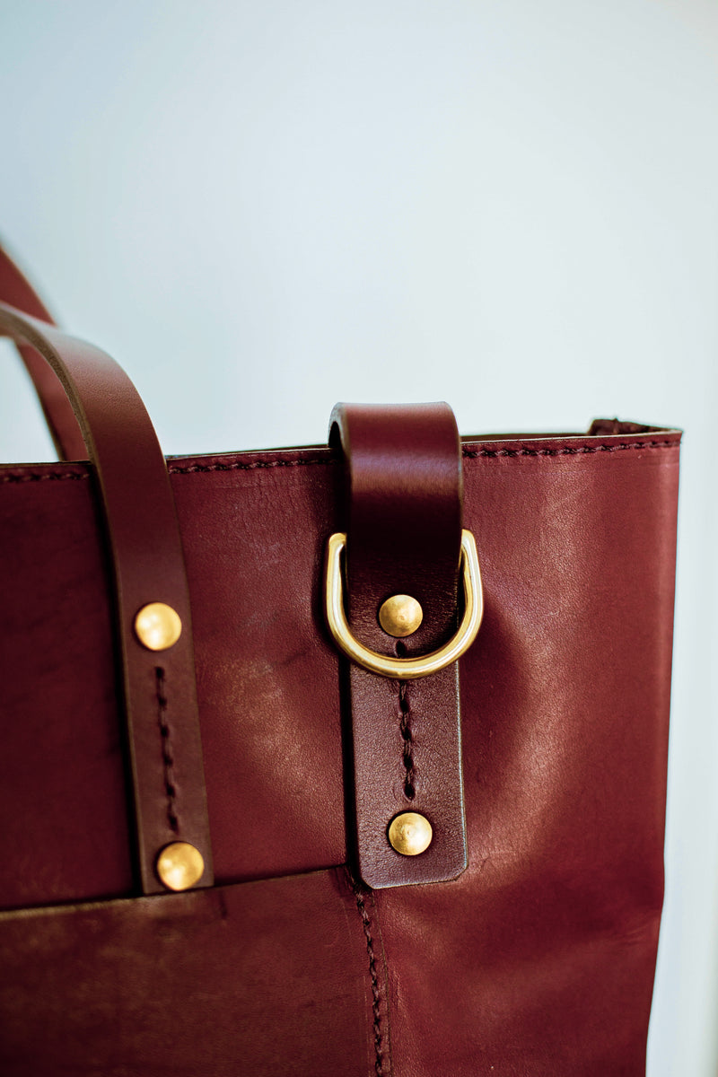 Brass buckle close up ofShire leather tote bag in oxblood made in canada crossbody