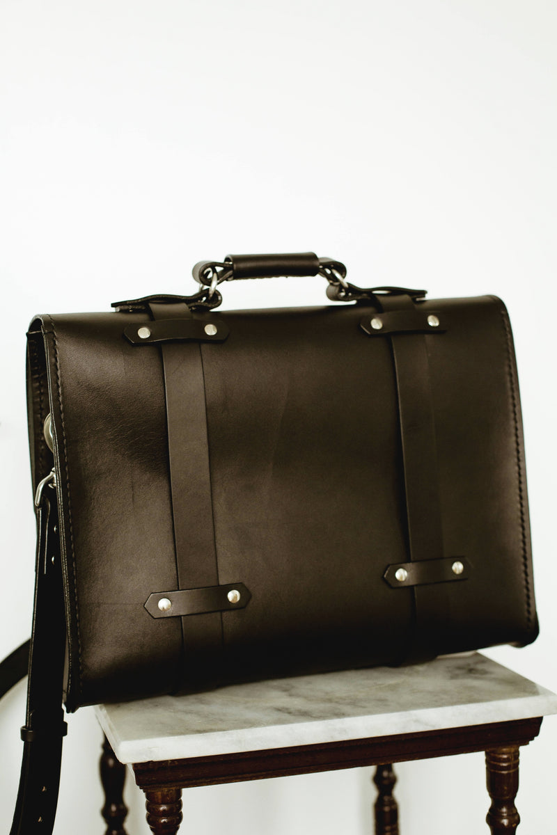 back side Oldenburg large leather messenger bag in black with stainless steel buckles 