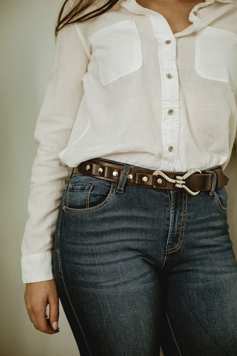 model wearing leather shire belt 1-1/4" in dark brown with stainless steel hook