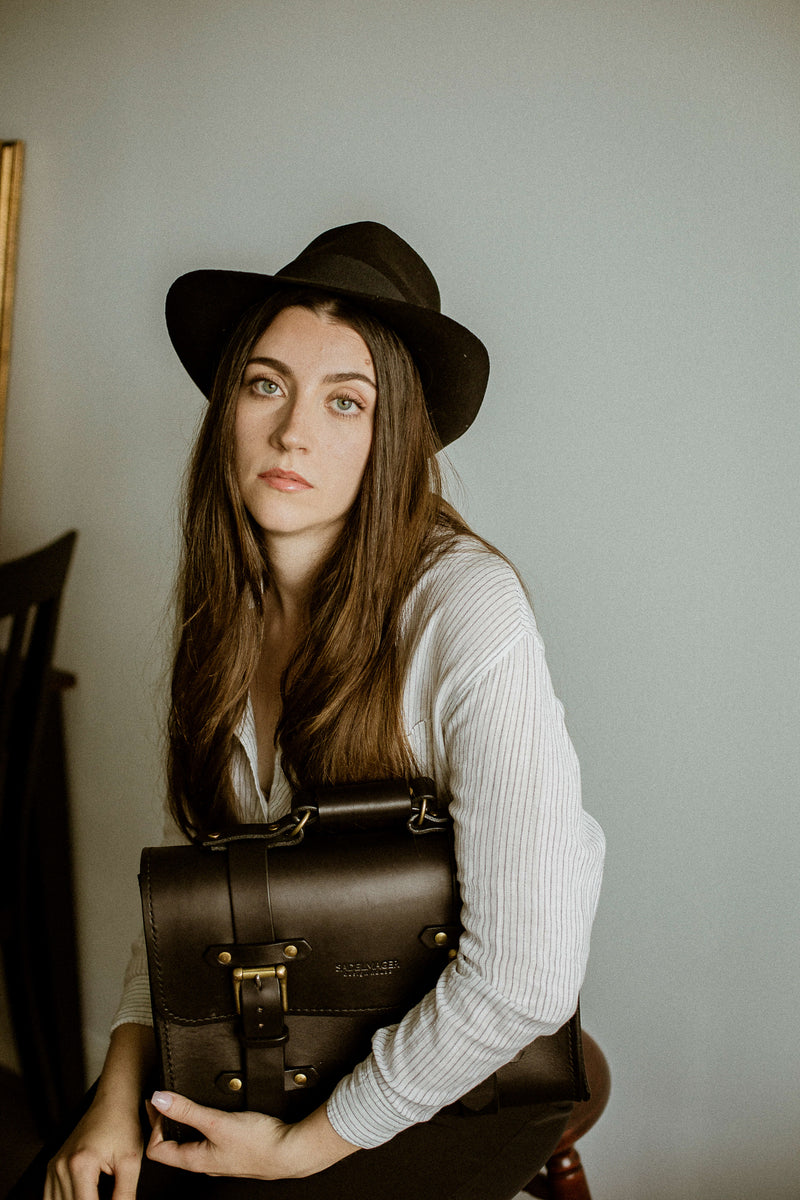 black leather bag that is made in canada modelled